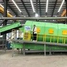Machine de filtrage à tambour pour système de tri automatique des solides dans une usine de tri des déchets
